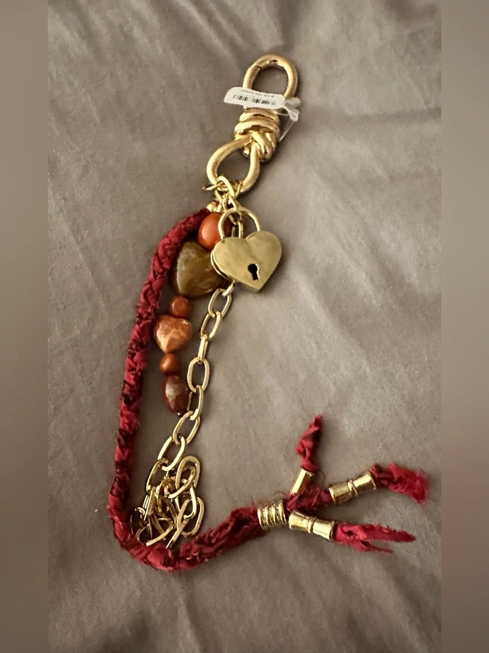 NWT Free People Semi Precious Charmed Strand Bag Charm Heart Lock Gold Red 12 in